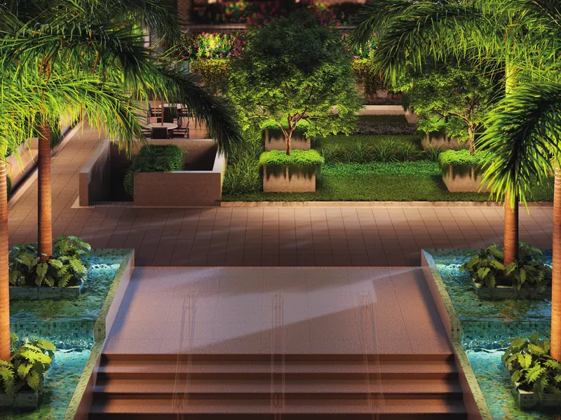 Espelho d'água com escadaria e jardins iluminados no Grand Quartier Rio2