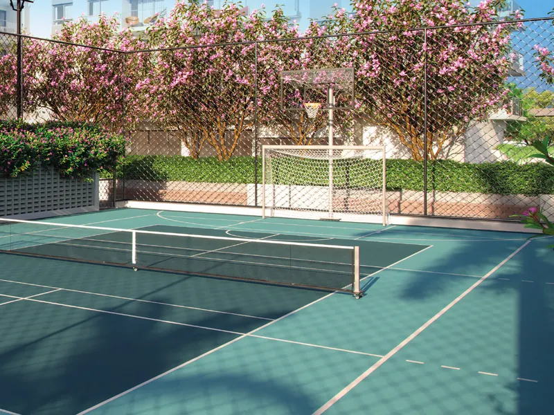 Quadra recreativa com pickleball do Grand Quartier Rio2 cercada de árvores floridas