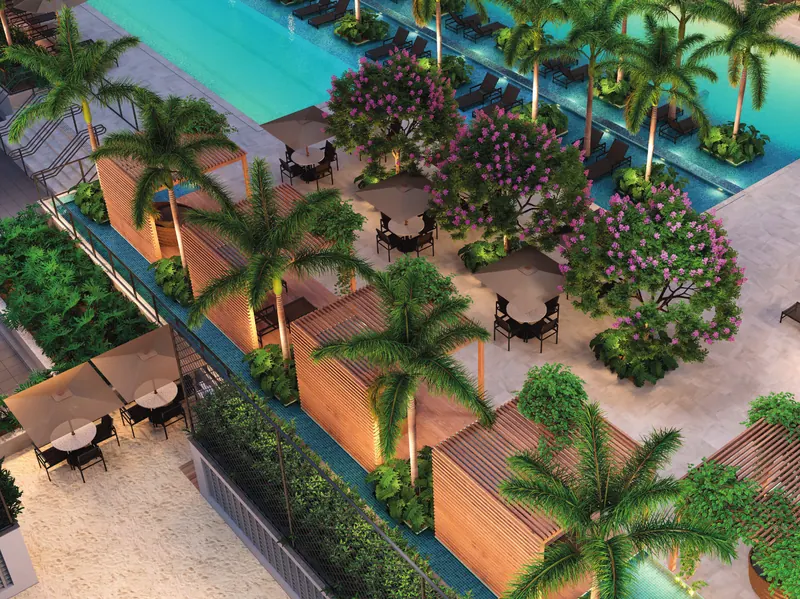Vista aérea das piscinas do Grand Quartier Rio2 com palmeiras, decks e jardins